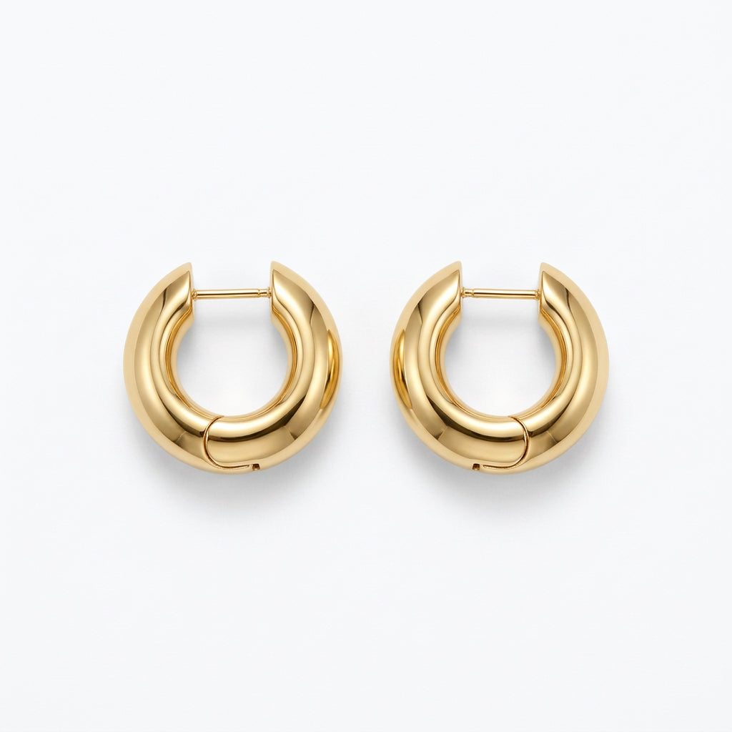 Kendra Scott Tatum Necklace and Hoop Earrings Box Set with thick, rounded gold hoop earrings.