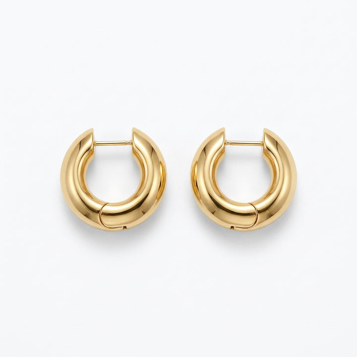 Kendra Scott Tatum Necklace and Hoop Earrings Box Set with thick, rounded gold hoop earrings.