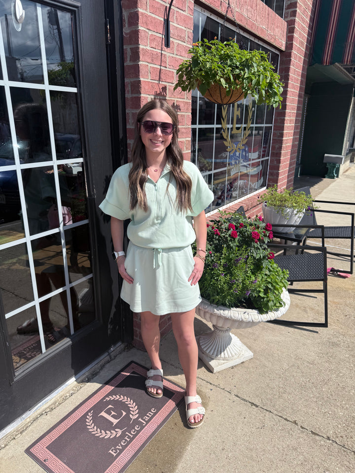 Modal Scuba Quarter Zip Short Sleeve Top in light green; available in sizes XS-XL.