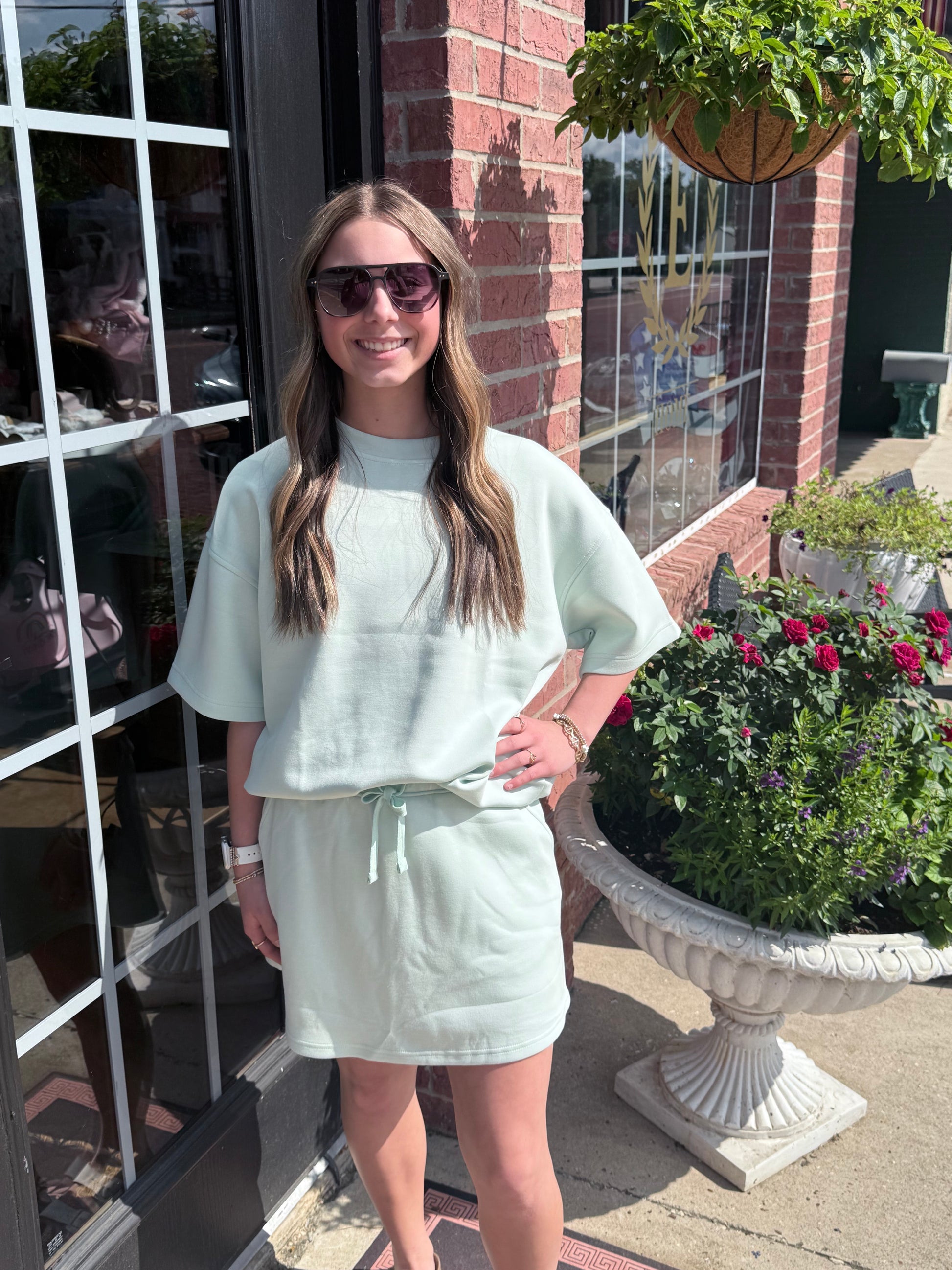 Modal Scuba Quarter Zip Short Sleeve Top in light green, available in sizes XS-XL.