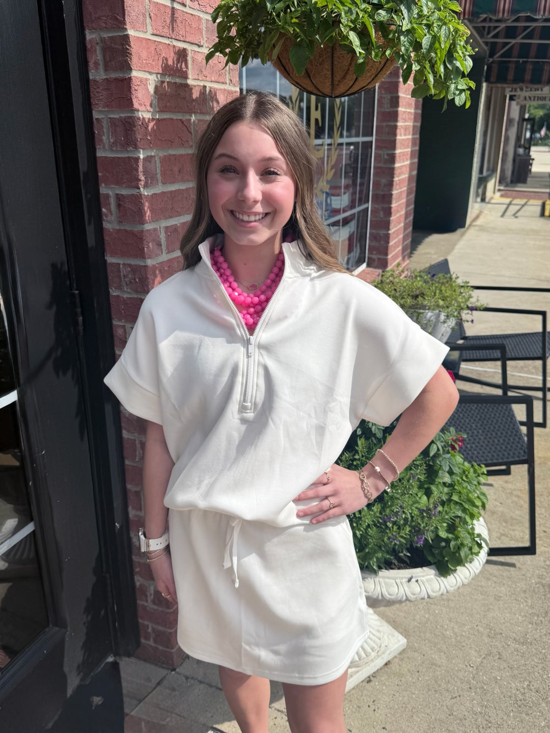 Modal Scuba Quarter Zip Short Sleeve Top in white; available in sizes XS-XL.