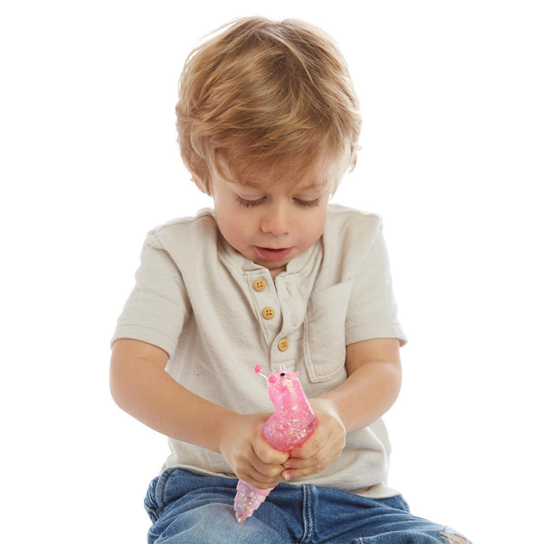 Pink glittery articulated Squishy Glitter Slug sensory toy.