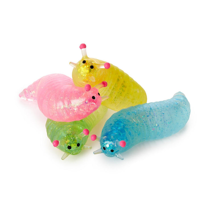 Pink, yellow, green, and blue translucent glittery Squishy Glitter Slugs with eye-tipped antennae.