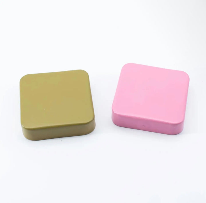 Olive green and pink square, lidded Jingle Pop Dice Tray units.