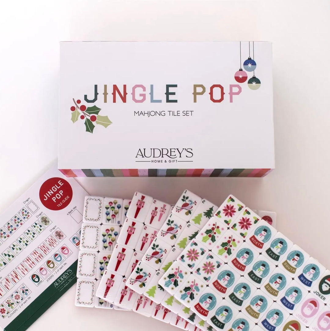 Christmas Mahjong set in a decorative box with a tile guide and holiday-themed tiles.