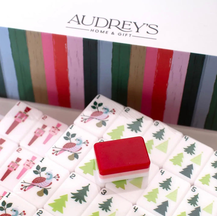American Mahjong tiles with holiday icons including nutcrackers, birds, and Christmas trees.