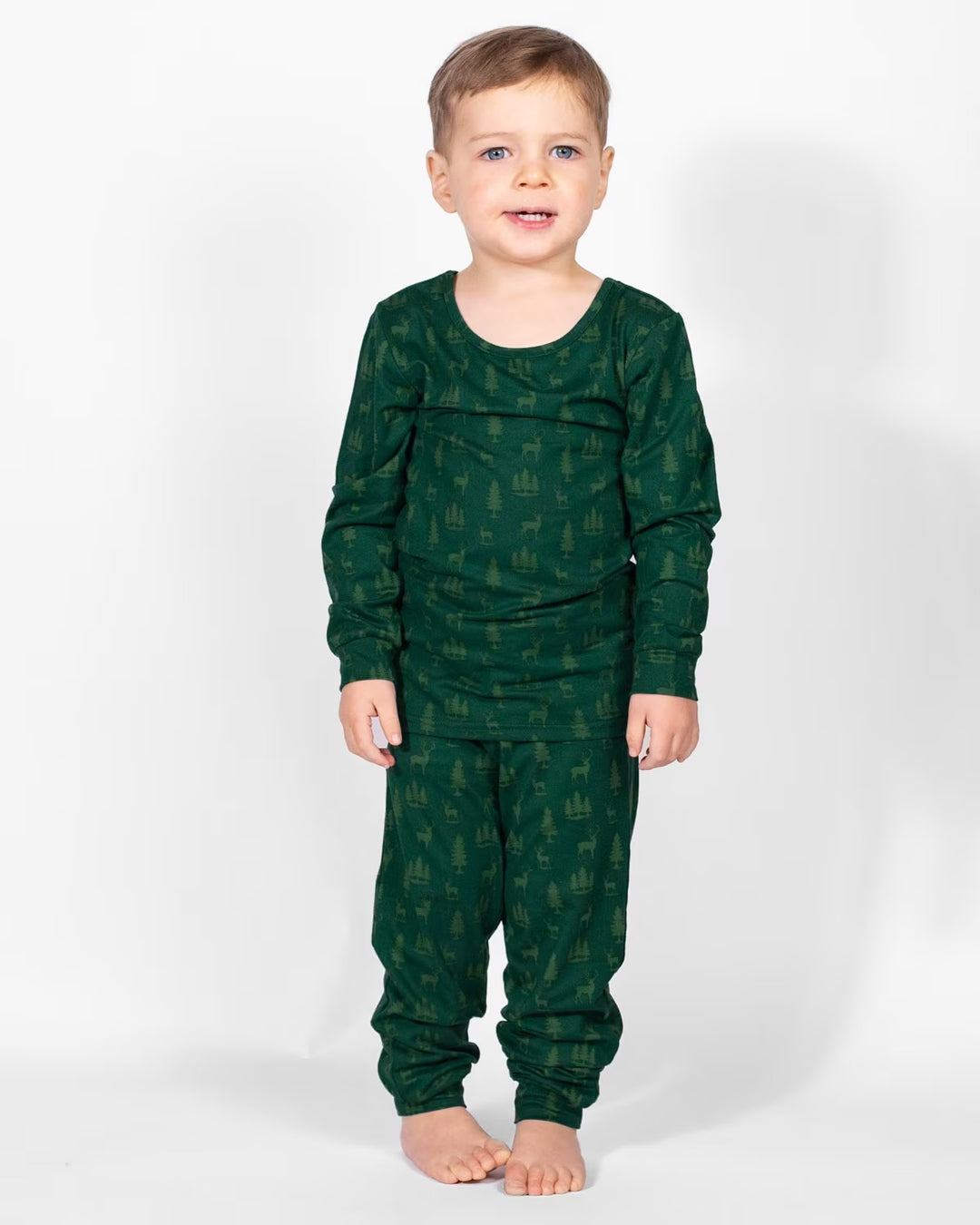 Dark green Kid’s Woodsy Deer long sleeve pajamas with forest and deer print.