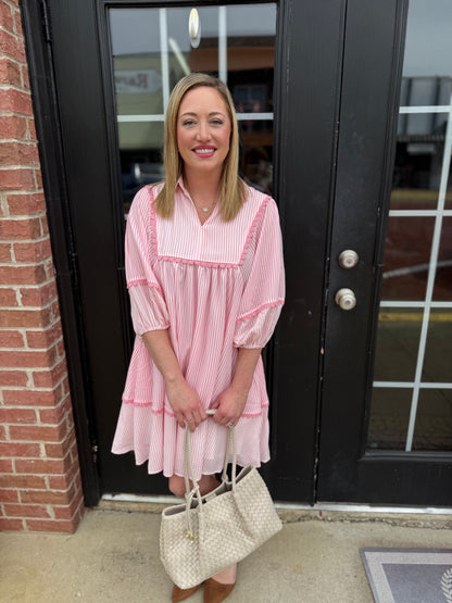 Pink Coastal Patch Dress in lightweight fabric, available in sizes XS-XL. Features a relaxed fit and vibrant patchwork pattern.