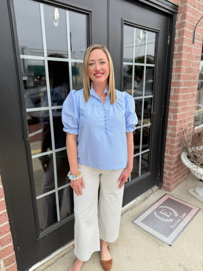 Seersucker Blue Striped Top, available in sizes XS-XL; lightweight fabric and relaxed fit for versatile styling.
