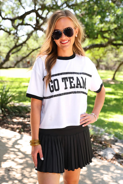 After Dark Pleated Tennis Skort in black, available in sizes XS–XL.