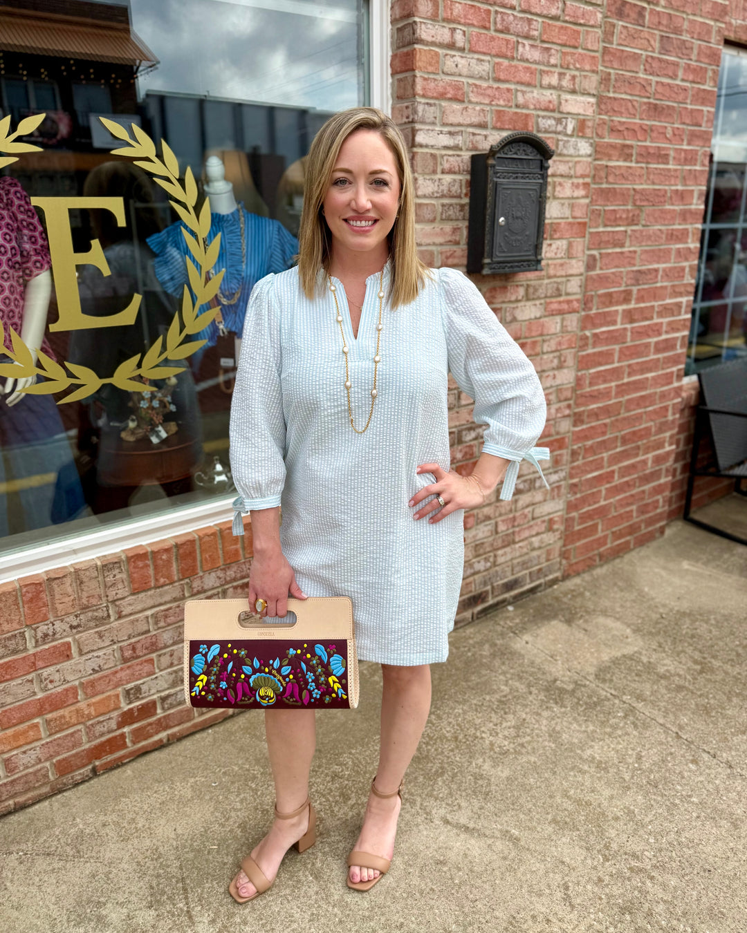 Lainey Seersucker Dress in Seafoam + White, available in sizes XS–XL. Features lightweight, striped fabric and relaxed fit.