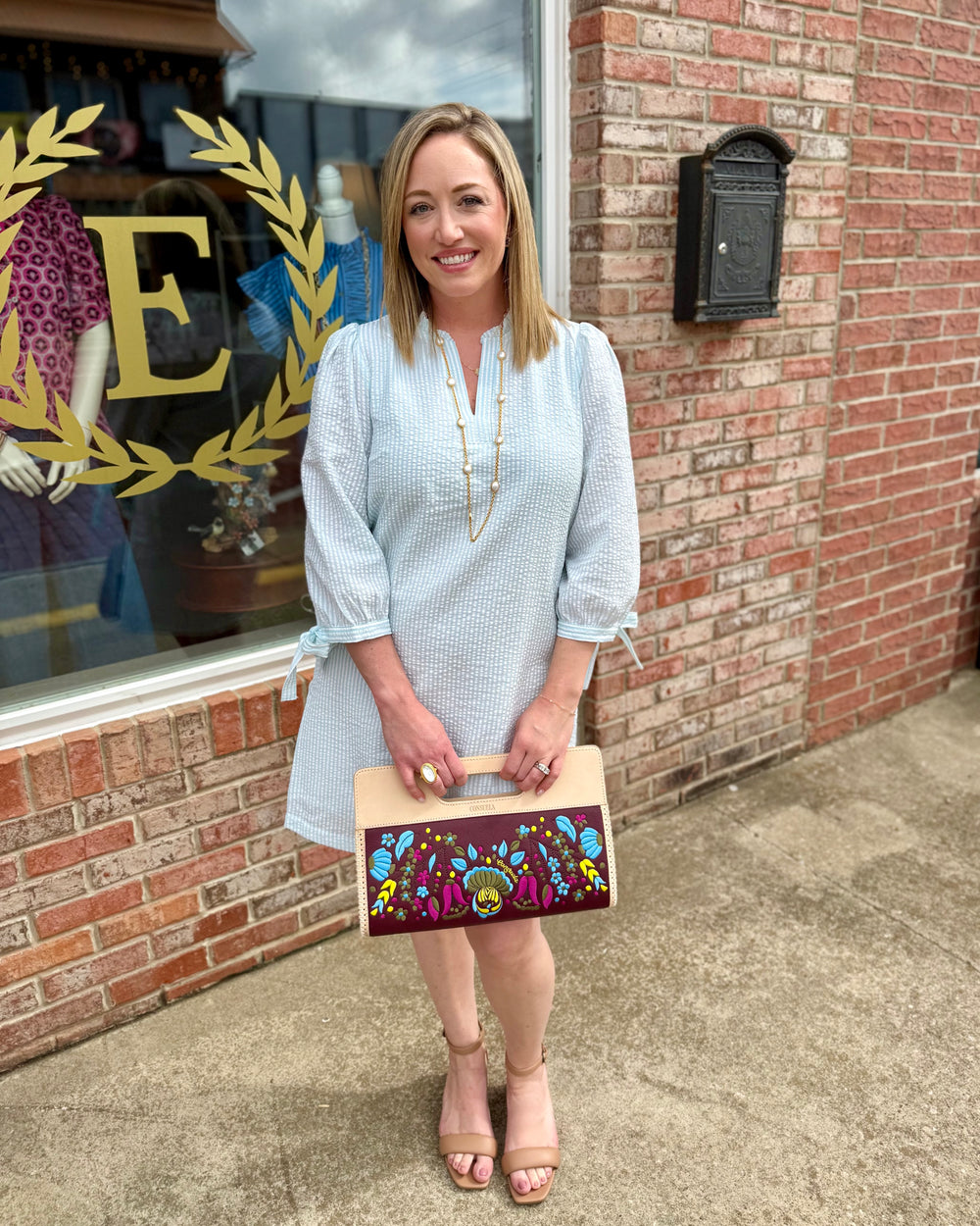 Lainey Seersucker Dress in Seafoam + White, ruffle V-neck, 3/4 sleeves; available in sizes XS–XL.