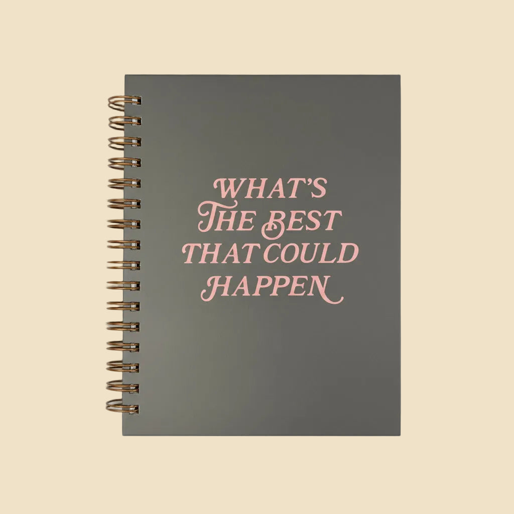 Gray, scratch-resistant spiral-bound journal with pink “What’s the Best That Could Happen” text and lined pages. Sizes: available.