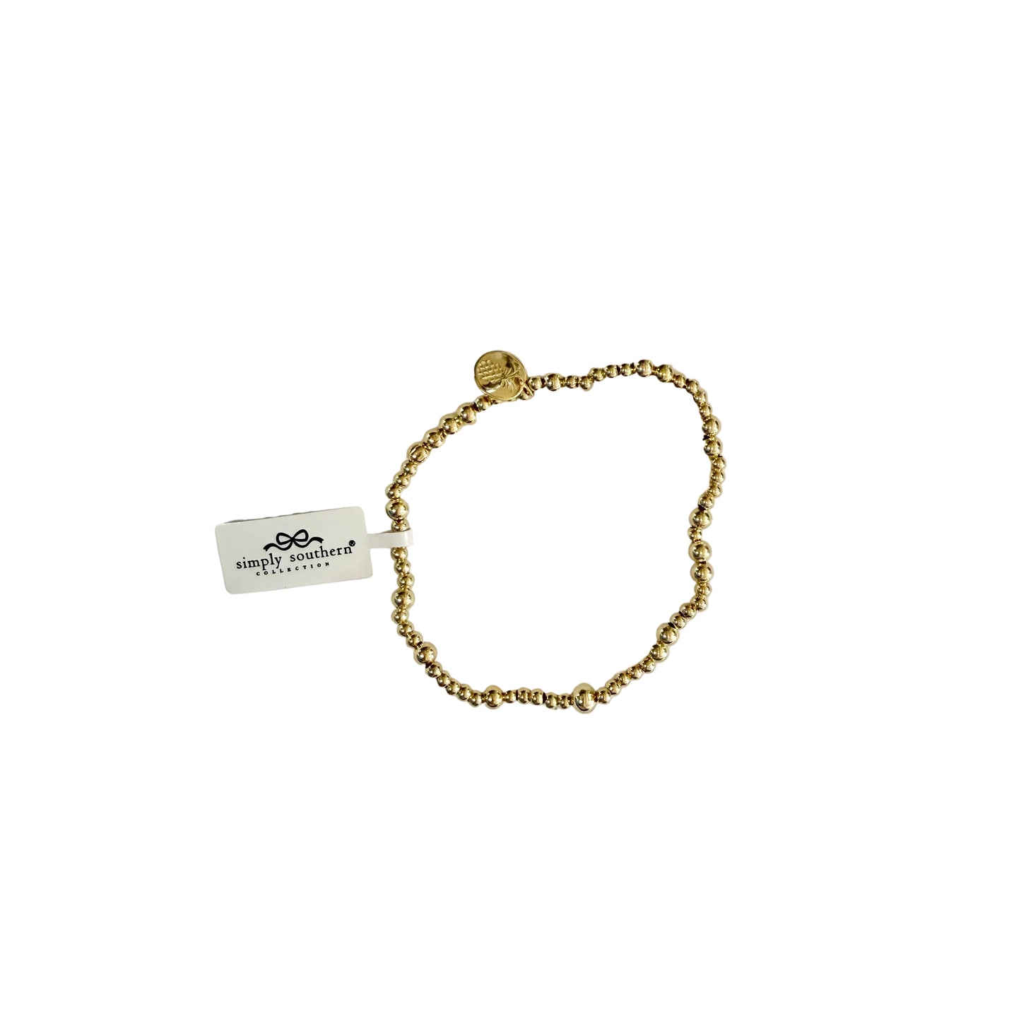 Gold beaded bracelet with accent beads, round charm, Simply Southern tag. Available in sizes S/M and M/L.
