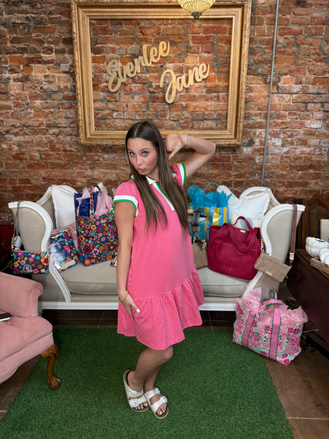 Carissa Dress in pink and white; available in sizes XS–XL.