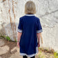 Luxe Woven Accent Dress in navy with white trim. Available in sizes XS–XL.