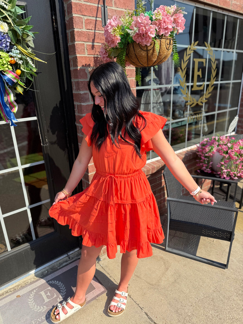 Bright orange Jacket Pride Flutter Sleeve Dress; flutter sleeves, knee-length. Available in sizes XS–XL.