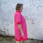 Luxe Woven Accent Dress in bright pink with red trim, available in sizes XS-XL.