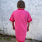 Bright pink Luxe Woven Accent Dress with red trim on sleeves and collar, knee-length. Available in sizes XS–XL.