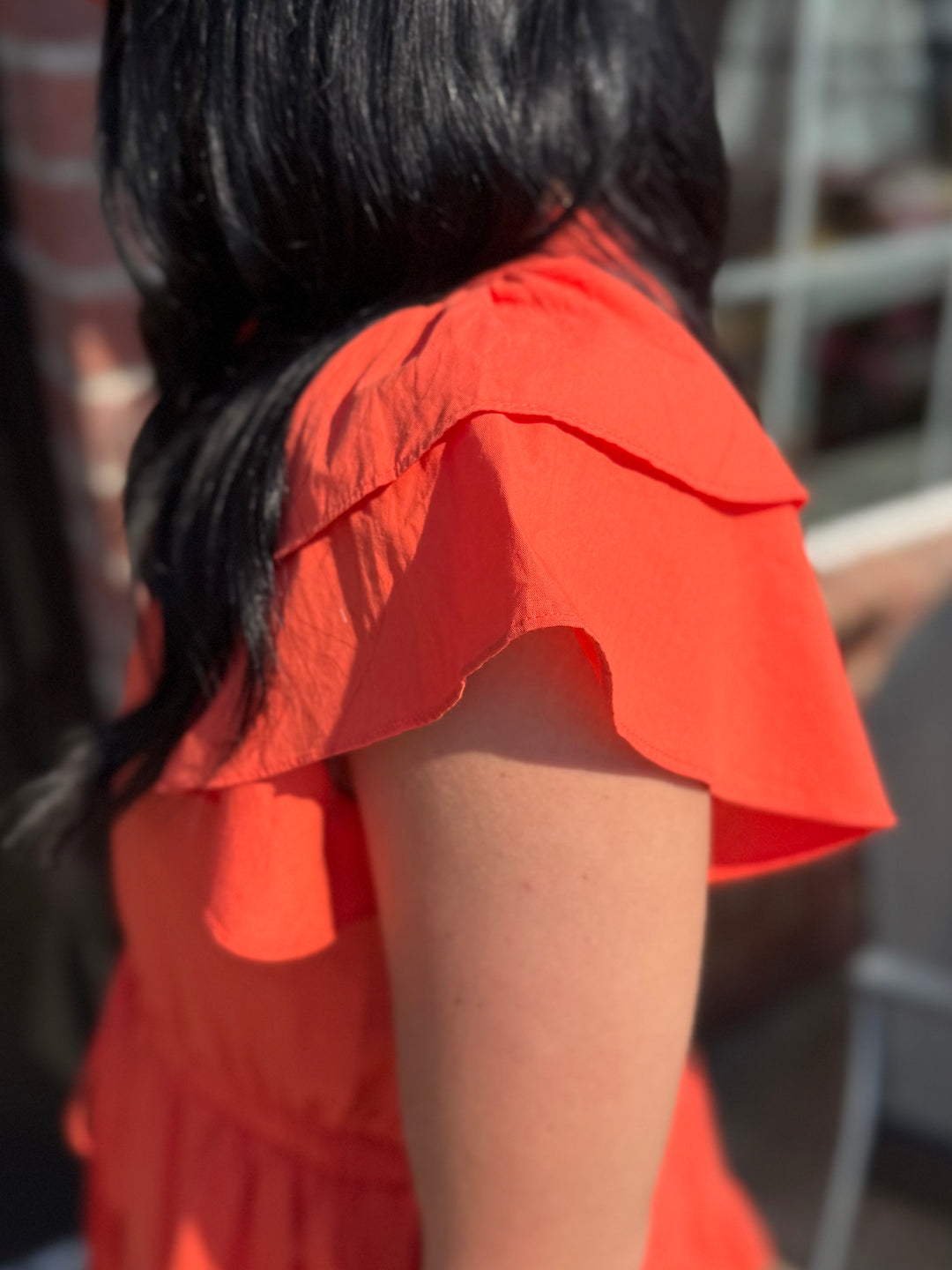 Jacket Pride Flutter Sleeve Dress with detailed shoulder and upper arm. Available in sizes XS–XL.