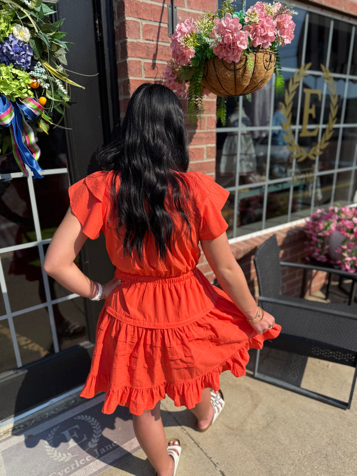 Jacket Pride Flutter Sleeve Dress shown; available in sizes XS-XL. White sandals not included.