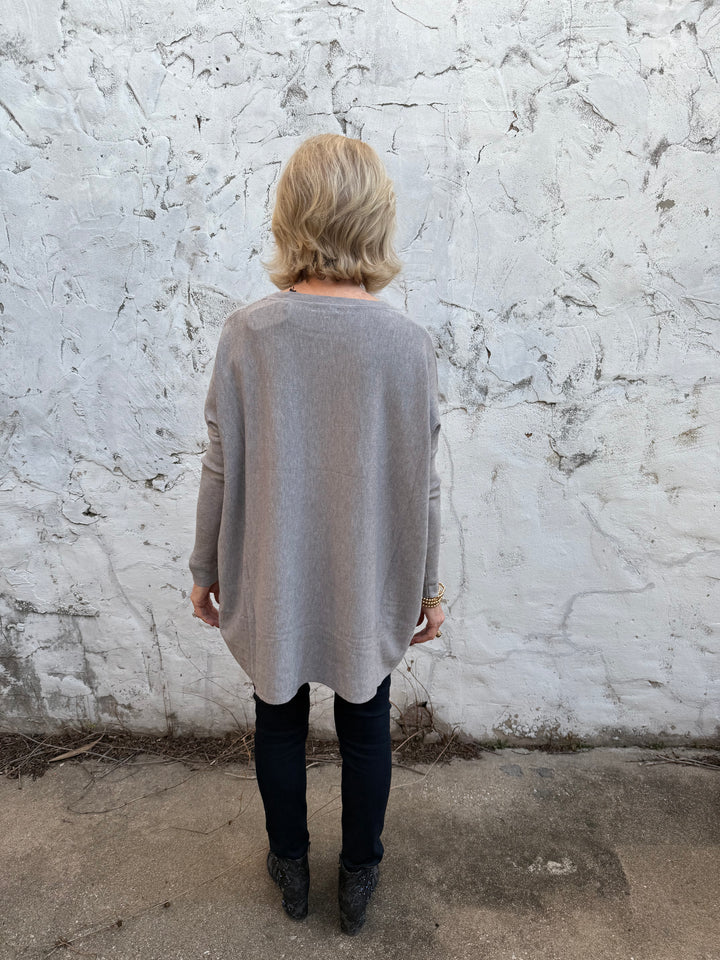Amelia Oversized Pocket Sweater Top in light gray, available in sizes S-XL. Features pocket detail and relaxed fit.