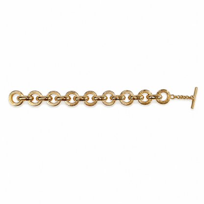 Interlocking Gold Link Toggle Bracelet with large circular gold-plated links and a toggle closure. Available in S, M, L.