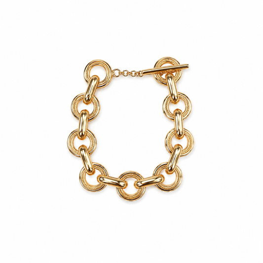 Interlocking Gold Link Toggle Bracelet with chunky gold-plated links and toggle closure. Available in S, M, L sizes.
