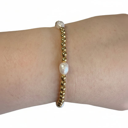 Beaded Gold Stretch Bracelets with two white irregular pearls. Available sizes: small, medium, large.