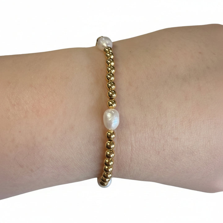 Beaded Gold Stretch Bracelets with two white irregular pearls. Available sizes: small, medium, large.
