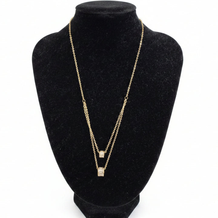 Gold dipped double strand necklace with square cubic zirconia pendants, available in 16" and 18" lengths.