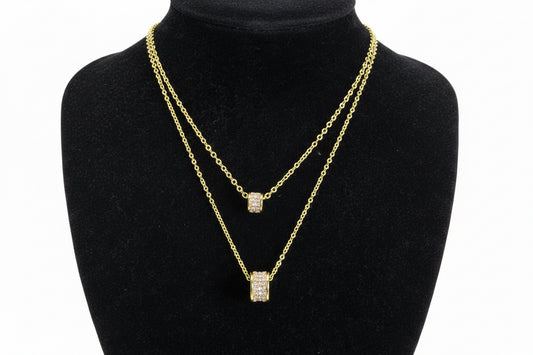 Gold Dipped Cubic Zirconia Double Strand Necklace with two square pendants. Available in 16" and 18" lengths.