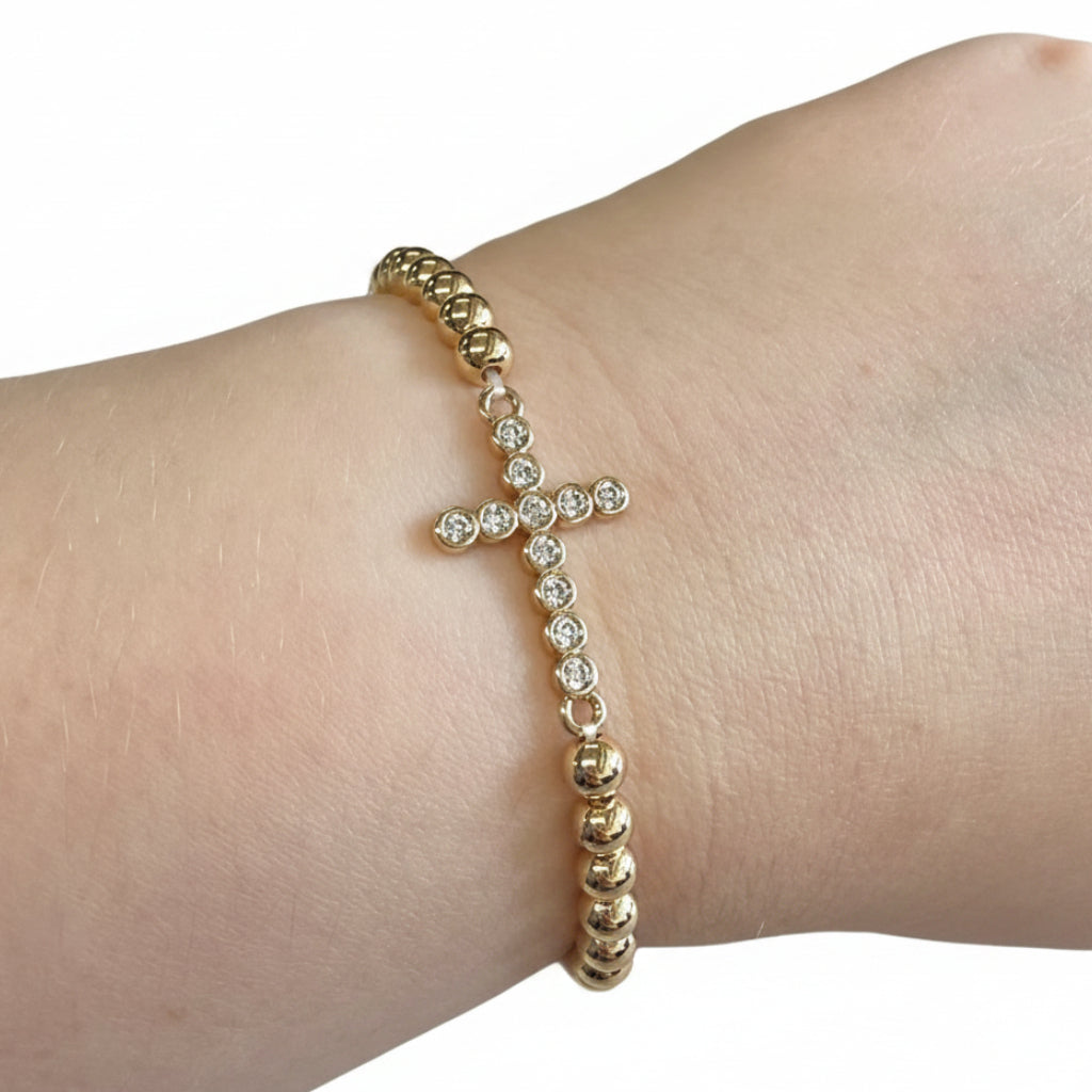Beaded Gold Dipped Stretch Bracelets with cross charm, clear gemstones. Available in S/M and M/L sizes.