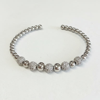 Silver open cuff bracelet with alternating smooth and textured round beads. Available in sizes S, M, L.