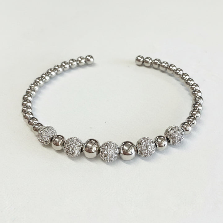 Silver open cuff bracelet with alternating smooth and textured round beads. Available in sizes S, M, L.