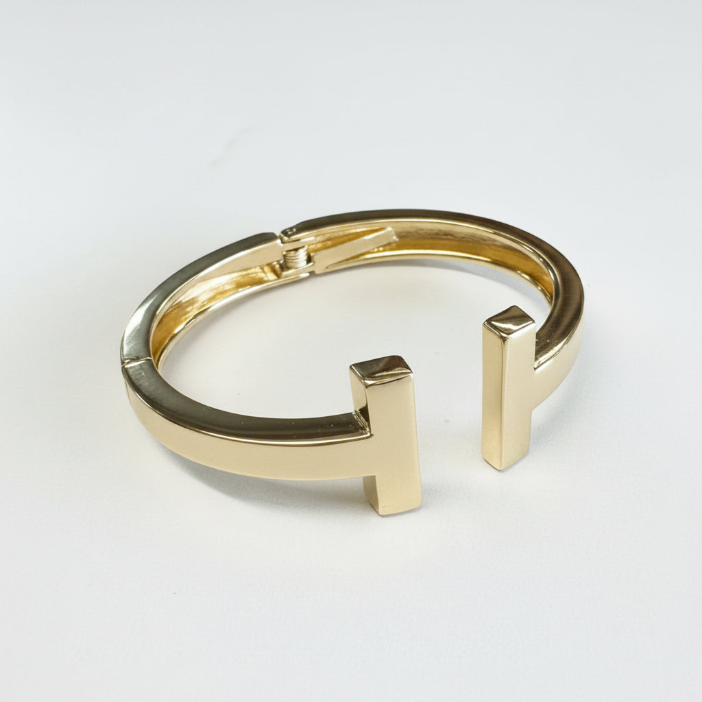 Stainless Steel Gold Dipped Cuff Bracelet with open front, parallel vertical bar ends. Available in S/M and M/L sizes.