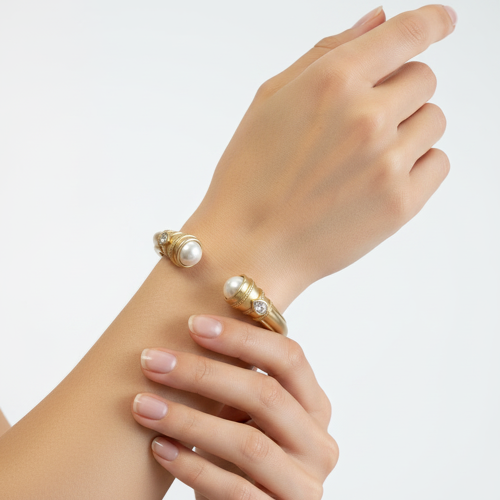 Stainless Steel Gold Dipped Cuff Bracelet with pearls and diamonds. Available in sizes S, M, and L.
