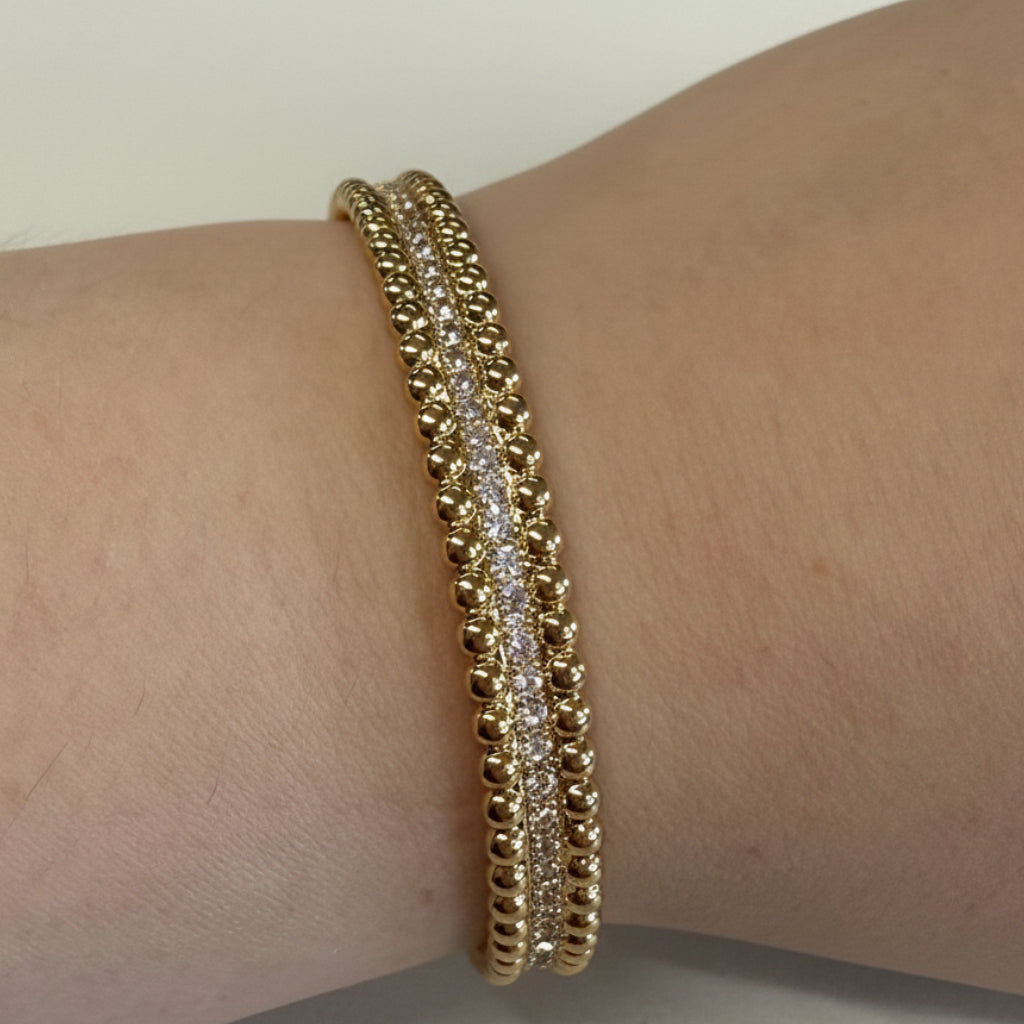 Gold beaded edge bracelet with clear stones and secure hinge. Available in S, M, L sizes.