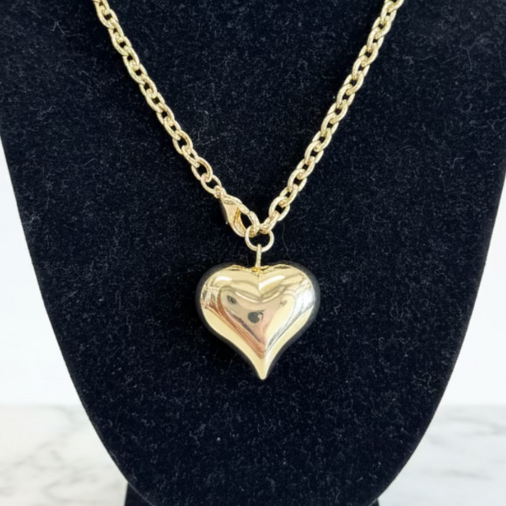 Stainless Steel Gold Dipped Heart Necklace with shiny heart pendant; available in 16", 18", and 20" sizes.