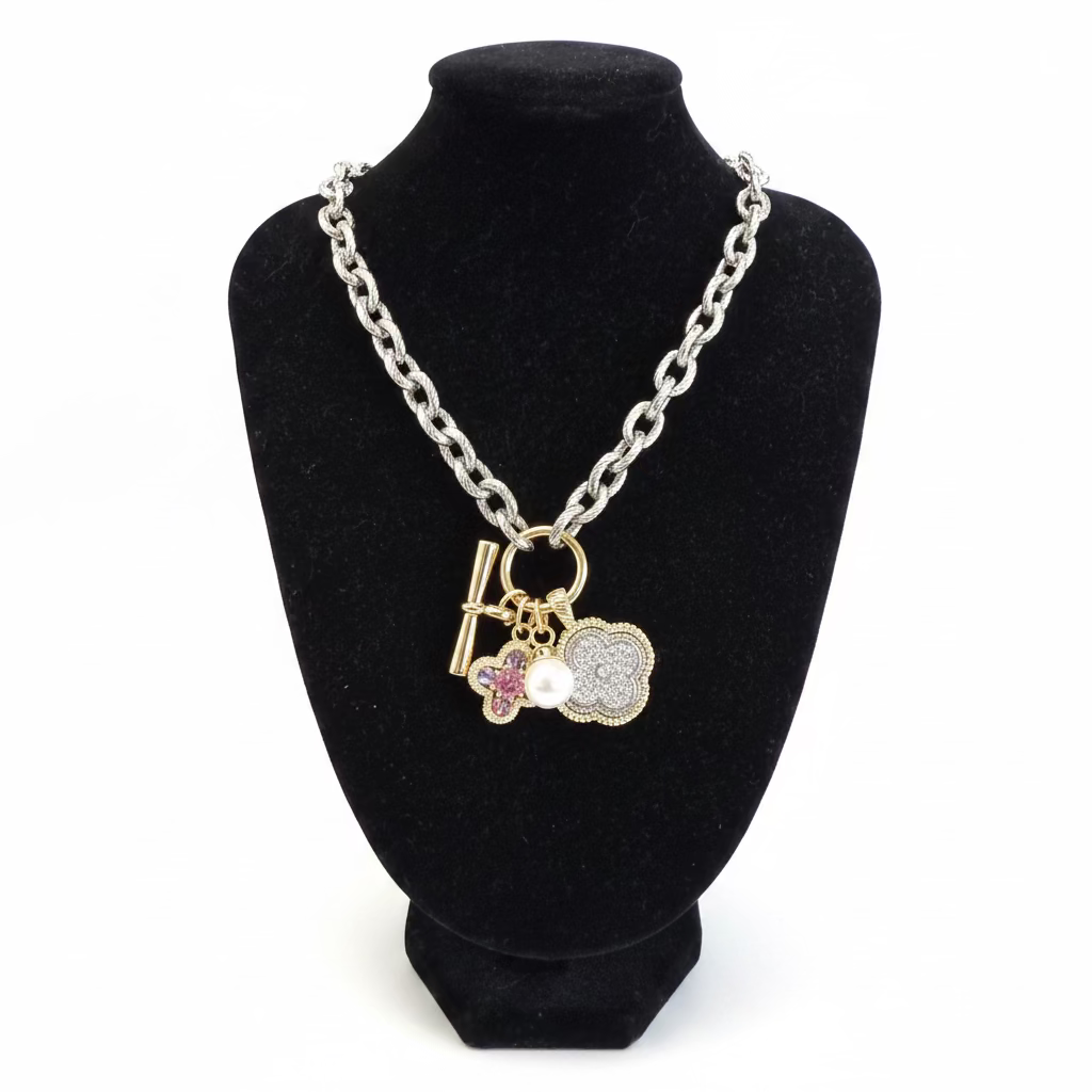 Multi Pendant CZ Chain Necklace with silver, gold, pearl, and pink flower charms. Available in 16", 18", and 20" lengths.