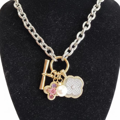 Multi Pendant CZ Chain Necklace with three gold charms in silver. Available sizes: 16", 18", and 20".
