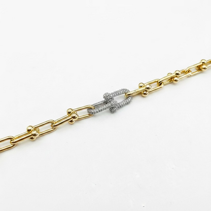 Rectangular gold and silver links, gold spheres, diamond-encrusted silver clasp. Available in small, medium, and large.