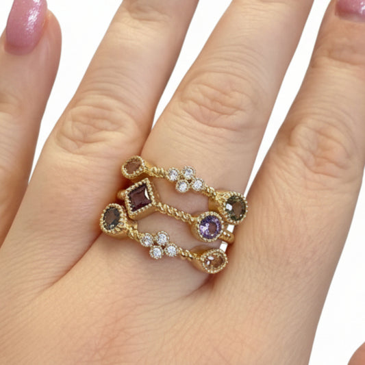 The Ring Edit: gold statement ring with colorful gemstones, small diamonds; available in sizes 5-9.