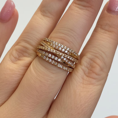 The Ring Edit: gold statement ring with intertwined bands and sparkling diamonds. Available in sizes 5-9.
