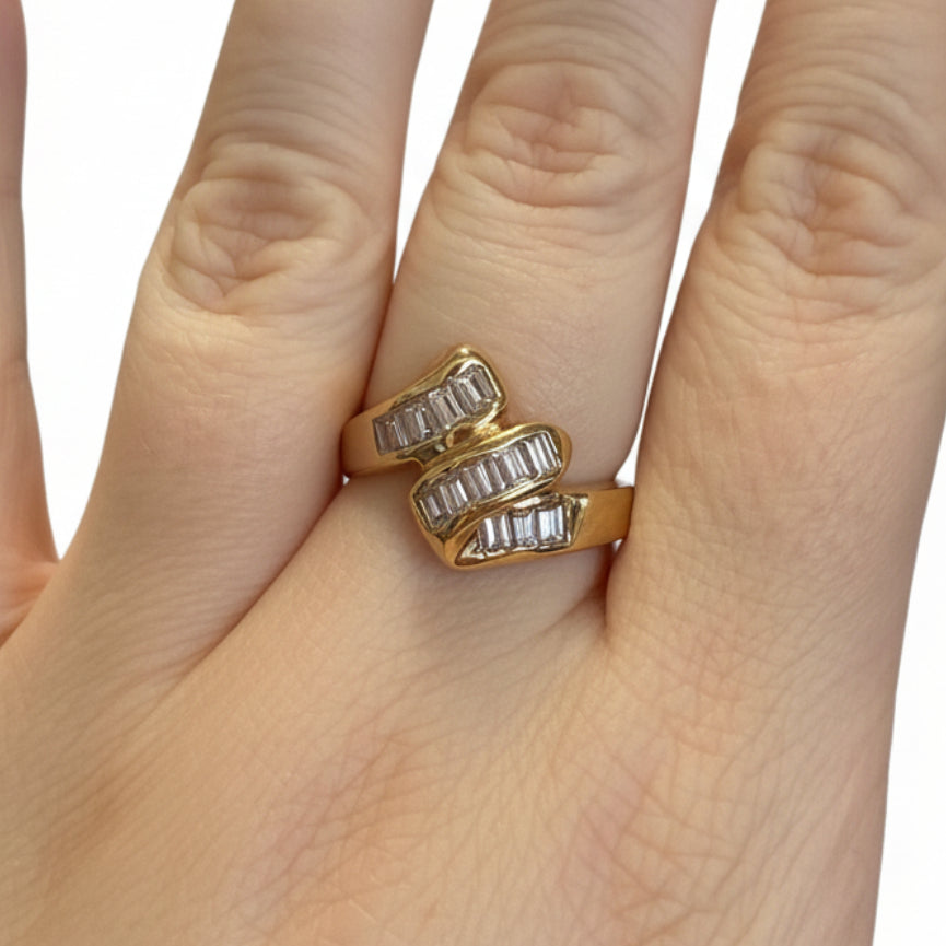 The Ring Edit: gold statement ring with three rows of rectangular clear stones. Available in sizes 6, 7, and 8.