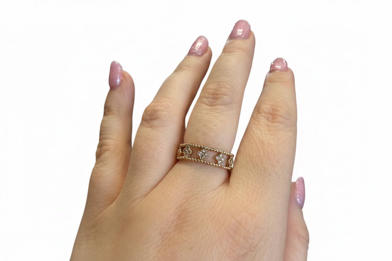 The Ring Edit: gold statement ring with heart-shaped designs and embedded stones. Available in sizes 6, 7, and 8.