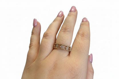 The Ring Edit: gold statement ring with heart-shaped designs and embedded stones. Available in sizes 6, 7, and 8.