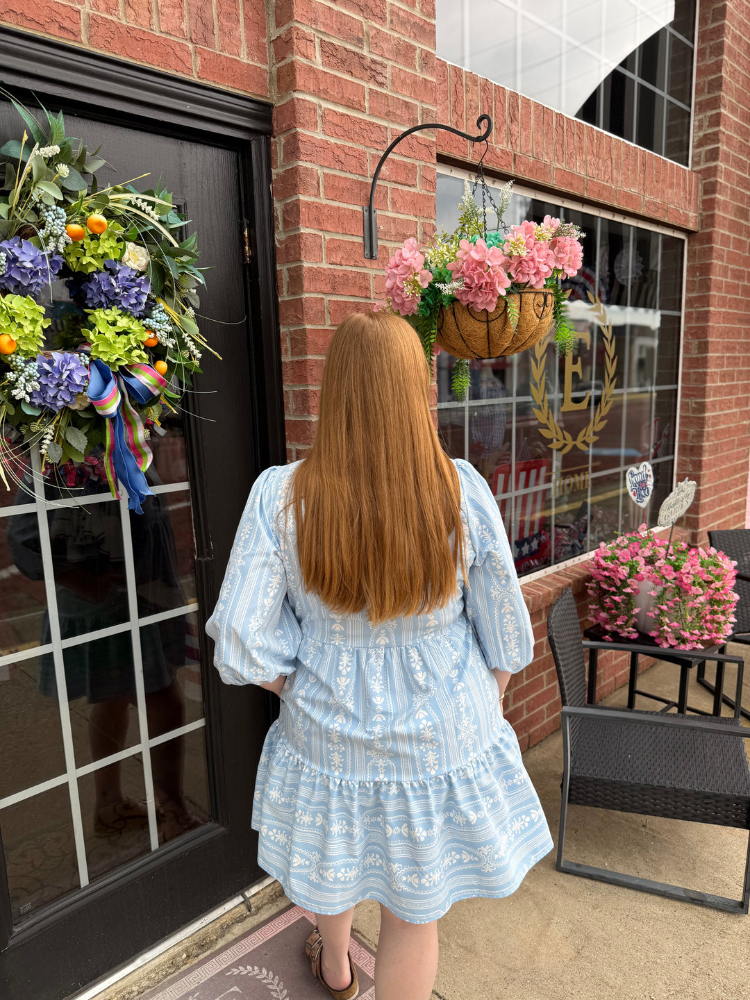 Riley Tulip Tapestry Blue Dress with 3/4 sleeves and tiered skirt; available in sizes XS-XL.