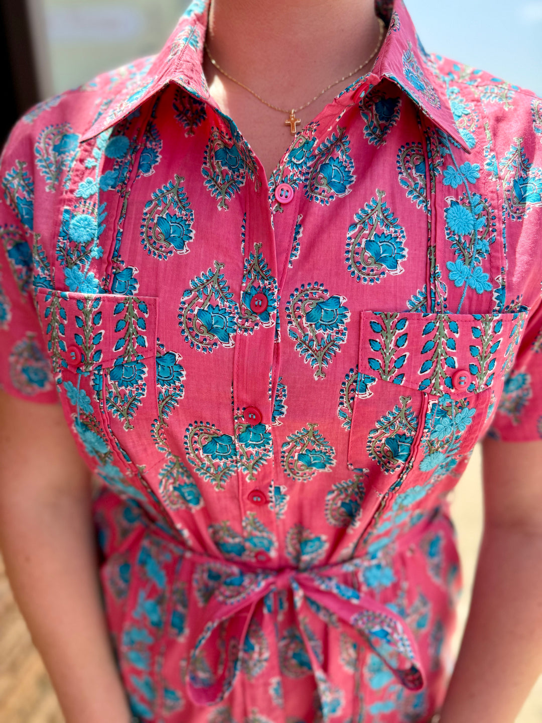 Geranium Dominga Dress: pink, blue floral/paisley, button-down, chest pockets, tie waist. Sizes: XS–XL.