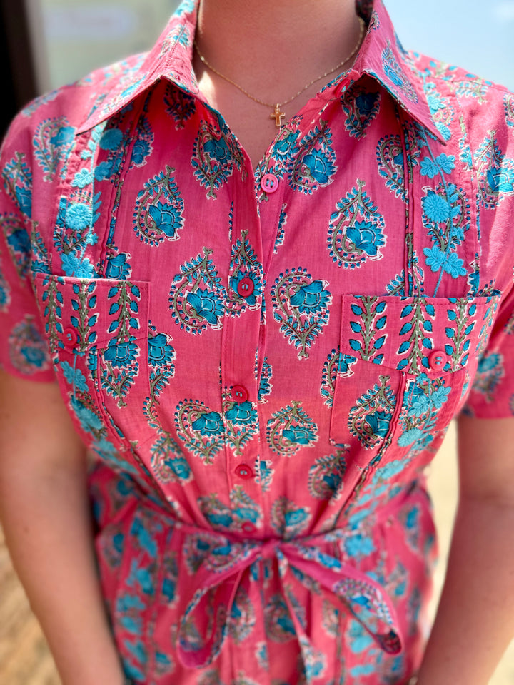 Geranium Dominga Dress: pink, blue floral/paisley, button-down, chest pockets, tie waist. Sizes: XS–XL.